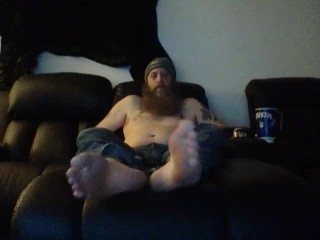 Bob hanging out barefoot in jeans