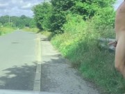 Naked with a semi in the road