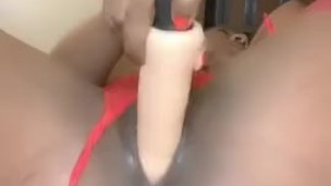Ebony masturbation with white dildo while watching porn