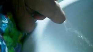 Uncut cock gets semi while pissing!