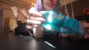 The Pose. Goth emo girl showing off dirty soles in a bdsm dungeon