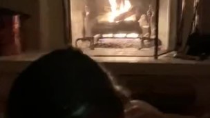 Sexy ass bitch sucks cock in front of the fireplace