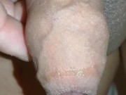 Slowmotion precum drool with foreskin hanging up close and personal