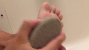 Teen Scrubs Feet With Foot Rock + Lotions