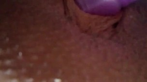 Masturbating using double headed vibrator