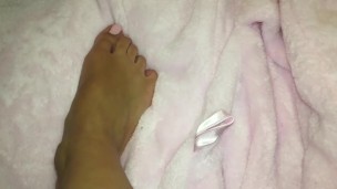 Pink Toed Teen Rubs Glitter Lotion On Feet