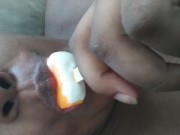 Sucking on a popsicle