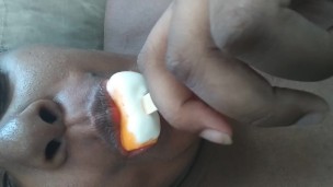 Sucking on a popsicle