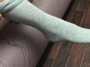 Sexy girl show feet in pantyhose and gray knee socks stockings