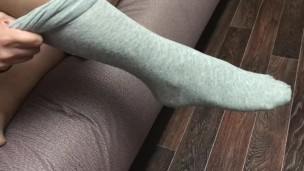 Sexy girl show feet in pantyhose and gray knee socks stockings