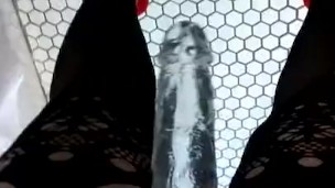 Domme strap-on with fishnet stockings, giggling