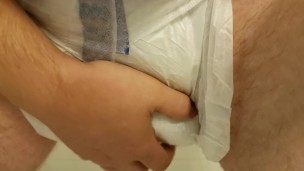 Playing with my diaper filled to the max