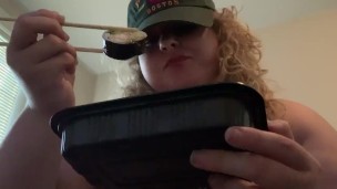 Fat bitch eats sushi