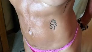 Marie works the lotion for the motion of the ocean..so sexy