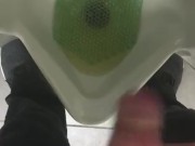 Pissing in a urinal in public at work