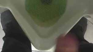 Pissing in a urinal in public at work