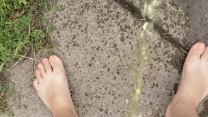 Babysitter Standing Pee Outside On Public Sidewalk