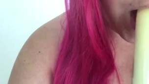 Chubby girl sucking on dildo