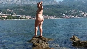 Mommy walks on a nudist beach