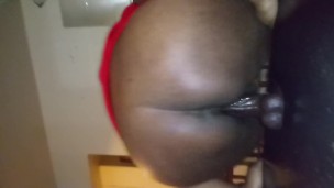 Ebony with juicy pussy riding dildo on table
