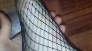 Sexy red high heels and fishnets