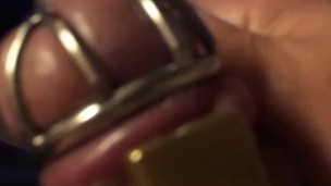 Watching Mistress Souzan squirt and squeezing balls while wearing cockcage