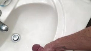 Hung guy jerks in bathroom
