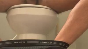 Soldier jacking off on toilet