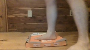 Muscular Legged Twink crushes box under feet