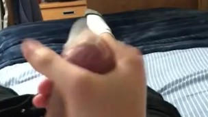 twink cums in too-small condom while waiting for roommate to come back