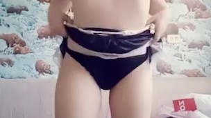 Little 18y.o. maid dances striptease and fondles her pink pussy