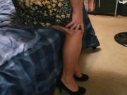 Sexy wife dangling high heels crossing legs adjusting skirt