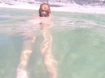 Naked girl on the beach. Naked girl on the beach masturbates.