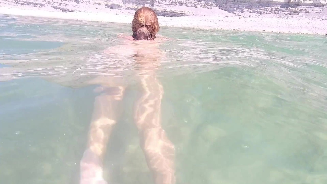 Naked girl on the beach. Naked girl on the beach masturbates.