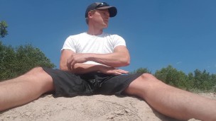 Risky pissing, jerking, and cumming on a public river bank