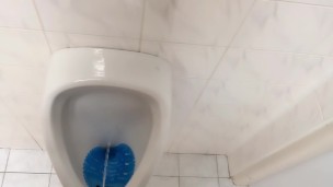 Peeing and moaning after pee desperation at the public urinal