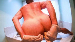 male solo fucking my ass with a dildo closeup from behind