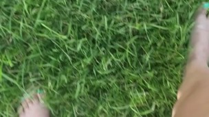 Girl Pees While Walking In Grass