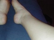 Purple socks & pink lights taking off socks after a long day 