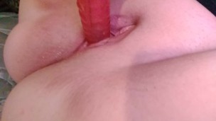 Rubbing clit and fucking big ribbed dildo