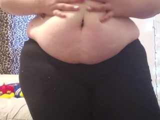 Chubby girl plays with jiggly belly