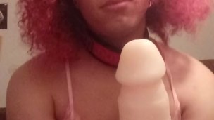 Cute crossdresser in pink sucks dildo