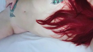 Redhead fingers her pussy while talking dirty