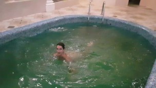 Girl jumps naked into the pool