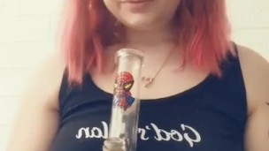 Cute teen takes a huge rip from her bong
