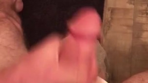 Stroking big cock on toilet