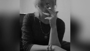 Smoking a cigarette after work. 