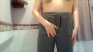 Wetting grey sweatpants and rubbing pussy