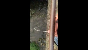 Twink piss from the bridge into the river