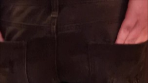 Putting on jeans hotpants over latex leggings